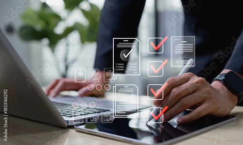 Digital document workflow and quality assurance concept, businessman reviewing electronic files on tablet, utilizing intelligent management system to validate records and streamline final approvals.