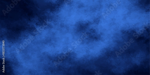 Dark blue abstract background of stormy night sky with clouds, fog, and light