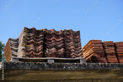 Stacked Clay Roof Tiles Awaiting Use
