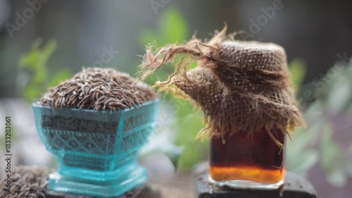 HD Video of Jeera Extract (Cuminum cyminum) in Glass Bottle – Natural Remedy for Digestion, Skin Glow, Hair Care, Aromatherapy, and Herbal Beauty Treatment Concepts