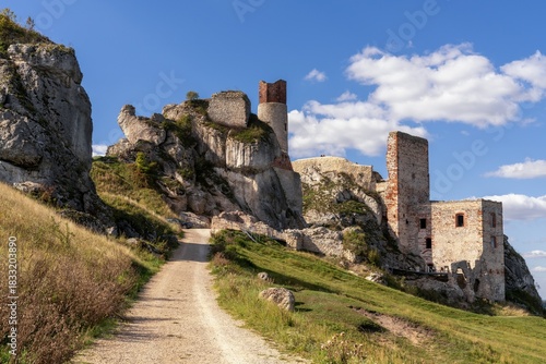 pathway leading to the ruins of Olsztyn Castle on a beautiful autumn day