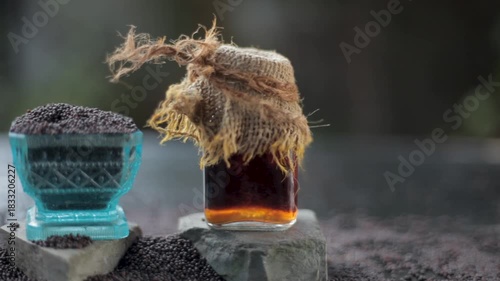 Closeup of Jeera Extract (Cuminum cyminum) in Glass Jar – Herbal Solution for Hair Strength, Skin Radiance, Digestive Health, Aromatic Therapy, and Natural Beauty Treatments