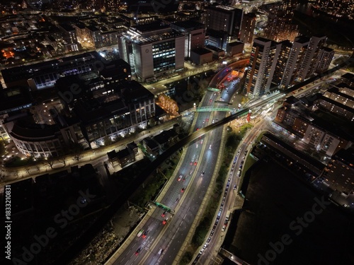 Overhead birds eye drone aerial view  Everning night Busy traffic  road network l East London
