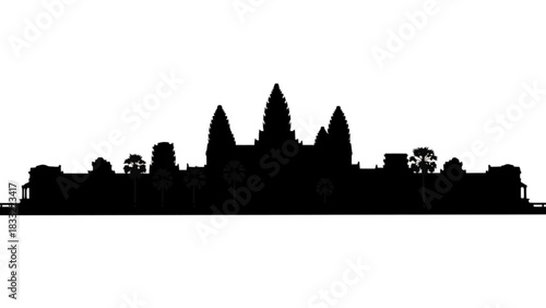 Silhouette of angkor wat temple complex with trees and intricate architectural details in cambodia landscape