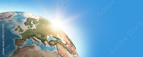 Sunrise on detailed satellite cartography of Earth globe, Western Europe, blue banner - Elements furnished by NASA