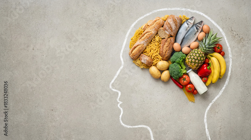 Brain food and healthy diet concept for mental wellness. A variety of fresh foods arranged in a human head shape.