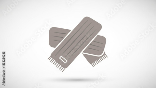 A simple modern flat icon illustration of two crossed grey winter scarves with fringe detail on a clean white background symbolizing warmth and fashion