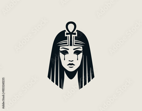 Mysterious black and white portrait of a powerful Egyptian queen wearing an elaborate winged headdress. Ancient mythology concept