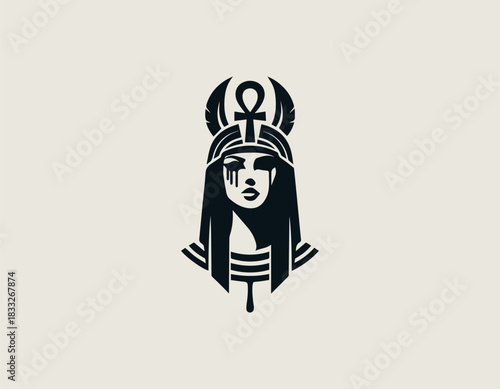Mysterious black and white portrait of a powerful Egyptian queen wearing an elaborate winged headdress. Ancient mythology concept