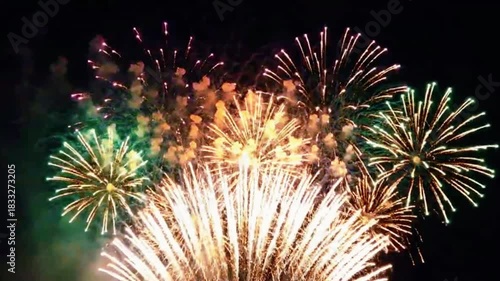 Bright colorful fireworks exploding in the night sky celebration