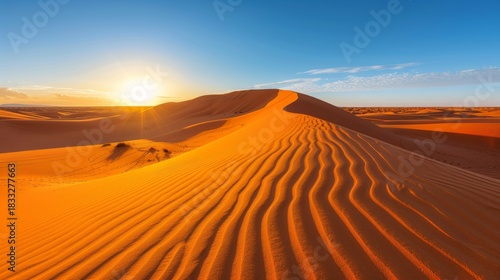 Fototapeta Naklejka Na Ścianę i Meble -  Minimalistic desert landscape featuring sand dunes under a golden sunset with warm tones
