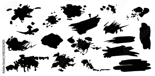 Collection of varied black ink splatters and brush strokes on a white background