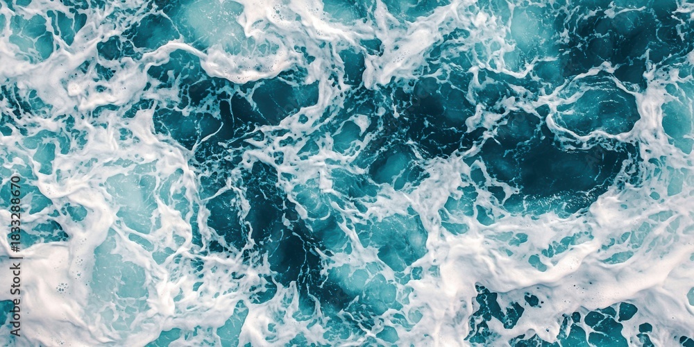 Naklejka premium A vibrant ocean surface, showcasing swirling patterns of deep blue and frothy white waves, capturing the dynamic beauty of water.