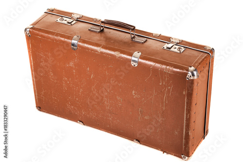 A well-worn brown suitcase sits on a white surface, showcasing its vintage design with a textured exterior and sturdy metal clasps. Perfect for travel or decorative use