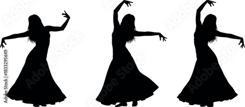  Silhouette of three belly dancers in flowing dress performing traditional oriental dance move isolated on