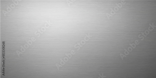 Brushed silver aluminum plate has a metallic texture and light reflection, providing a gray backdrop