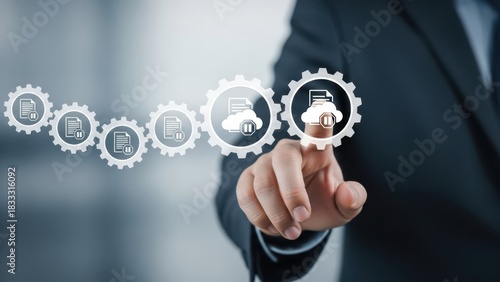 Businessman s finger touches a digital gear with cloud icon representing cloud computing and technology integration