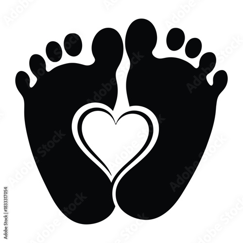 Baby feet with heart shape symbolizing love and care for newborn child in black and white
