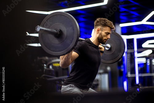 Young man performs strength...