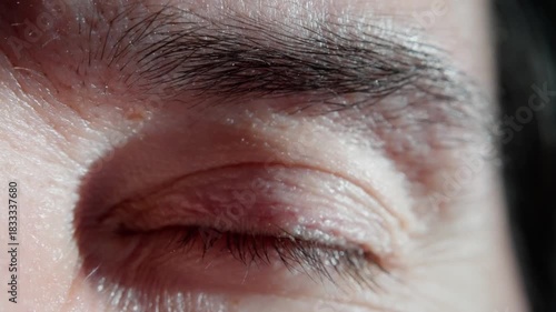 fatigued person with sleepy gaze, person displaying signs of exhaustion through drowsy eye features, exhausted individual demonstrating delicate cues of sleepiness in their eye appearance