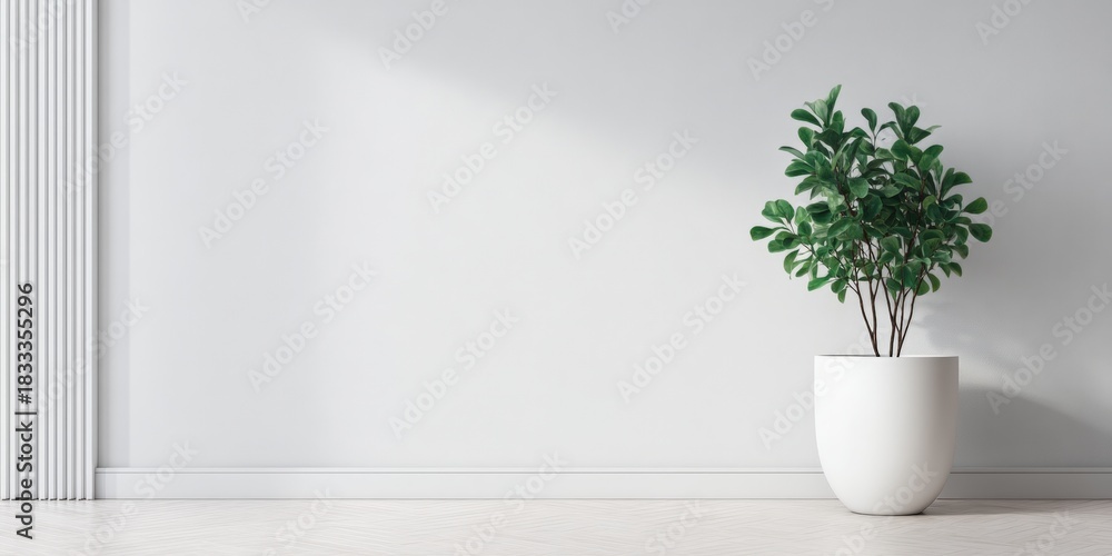 Fototapeta premium A minimalist interior featuring a green plant in a sleek white pot against a neutral wall, highlighting modern design and tranquility.