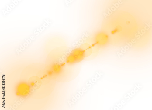 Soft golden diagonal lens flare with warm glow and gentle light particles
