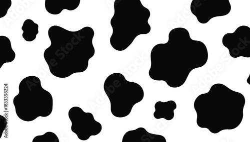 Black and white cow print pattern with irregular spots and organic shapes on a clean background