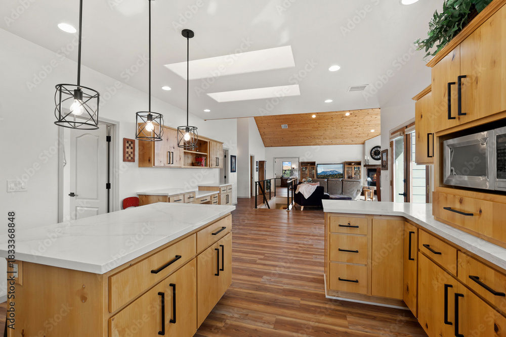 Fototapeta premium Openconcept Kitchen With Skylights, Wide Galley Style Kitchen With Natural Light And Sleek Counters