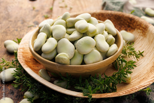 Fresh broad bean in a ceramic bowl, close up view