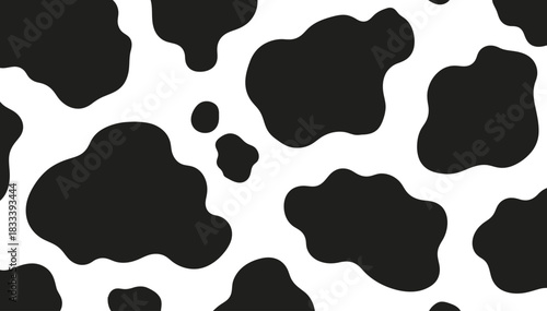 Seamless black and white cow print pattern for textile design and backgrounds
