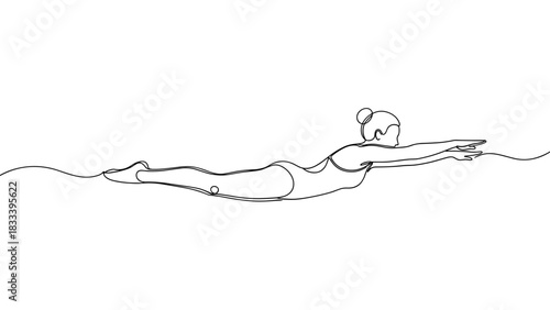 Woman swimming in the water with arms extended and body streamlined  