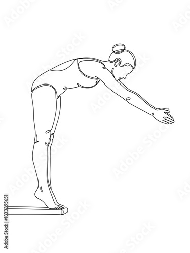 Female diver preparing to dive off the board in athletic stance  