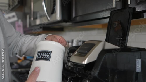 4K @30FPSscooping coffee grounds into a drip coffee maker