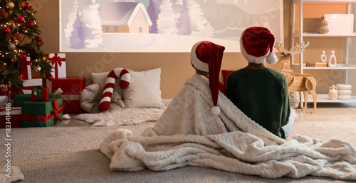 Children in Santa hats with...