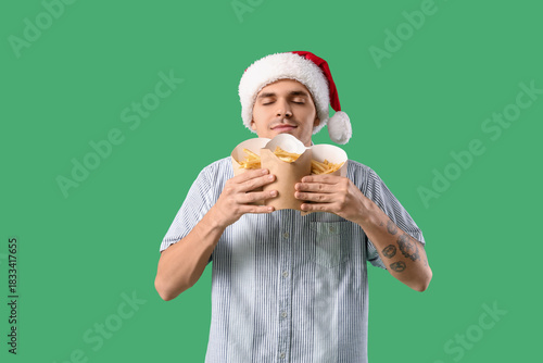 Young man in Santa hat with...