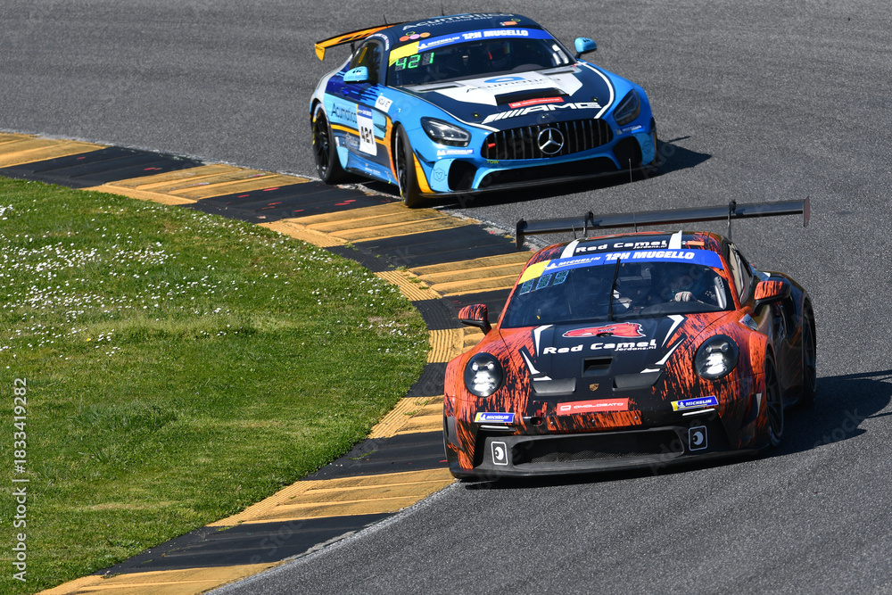 Naklejka premium Scarperia, Italy - March 20th 2025: Porsche 911 GT3 Cup (992) of Team Red Camel-Jordans.nl drive by Rik-Breukers-Danz in action during 12h Michelin at Mugello Circuit.