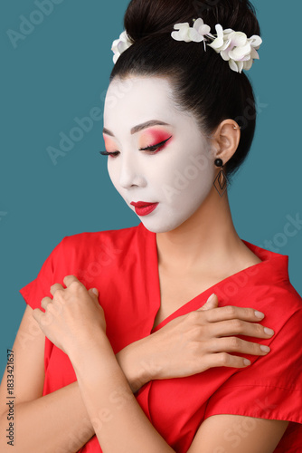 Beautiful young geisha on b...