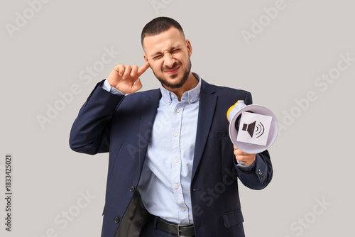 Young businessman with mega...