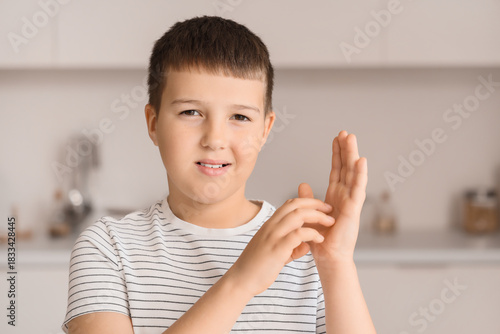Mute boy using sign languag...