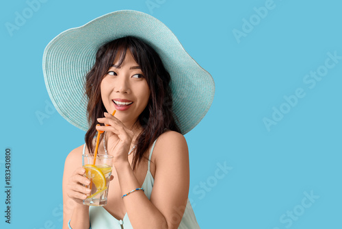 Young Asian woman with citr...