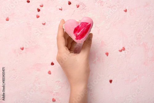 Female hand with sweet hear...