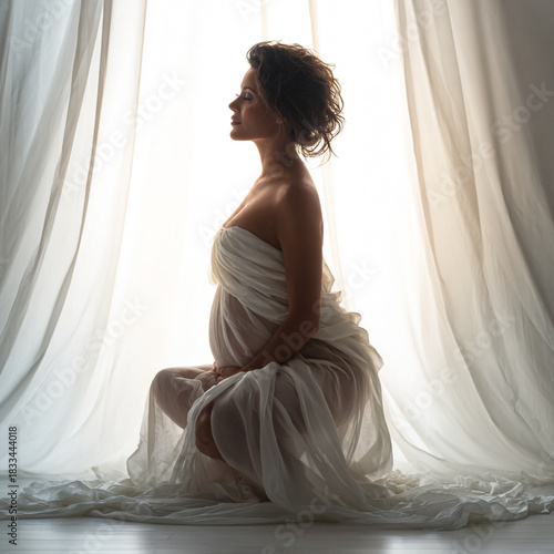 pregnant young woman in a white dress
