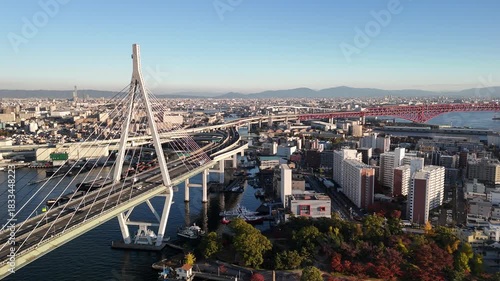 Tempozan Bridge at Sunset, Konohana and Minato Ward, Osaka Bay, Japan: 4K Drone Views of Harbour, Wharf, Ferris Wheel, Ocean Reflections, Industrial Port, Minato Ward Skyline, Golden Hour Over Osaka
