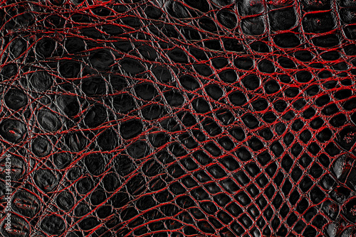 Dark red crocodile leather texture as background. Natural reptile skin. Crocodile skin pattern.
