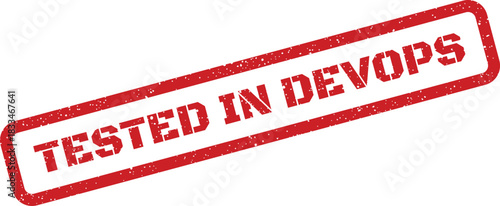 A textured red rubber stamp with the bold uppercase text TESTED IN DEVOPS within a rectangular frame, symbolizing modern software development validation