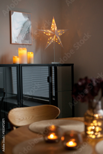 Led lights and interior decor on wooden table in scandinavian room. Hygge life style.