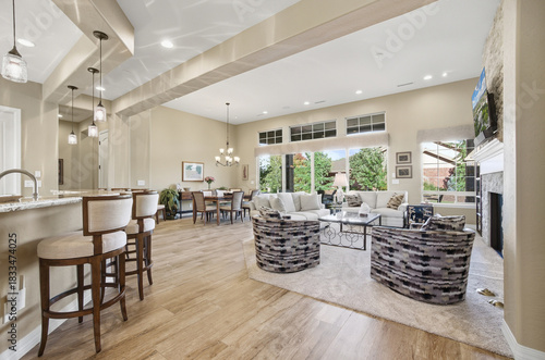 Elegant Open Layout, Refined Open Concept Space Showcasing Central Island Along With Warm Seating Setup