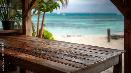 Wooden Beachside Bar Counter Overlooking Clear Ocean Water and Sandy Shore