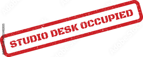 Red distressed rubber stamp with the message Studio Desk Occupied indicating a workspace is currently in use, ideal for office and creative environment status boards