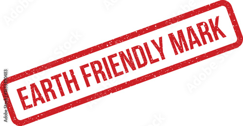 A red distressed rectangular rubber stamp with the bold text EARTH FRIENDLY MARK on a clean surface